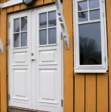 Entrance doors and window(side hung) installed in house