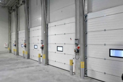 Industrial garage doors with integrated window